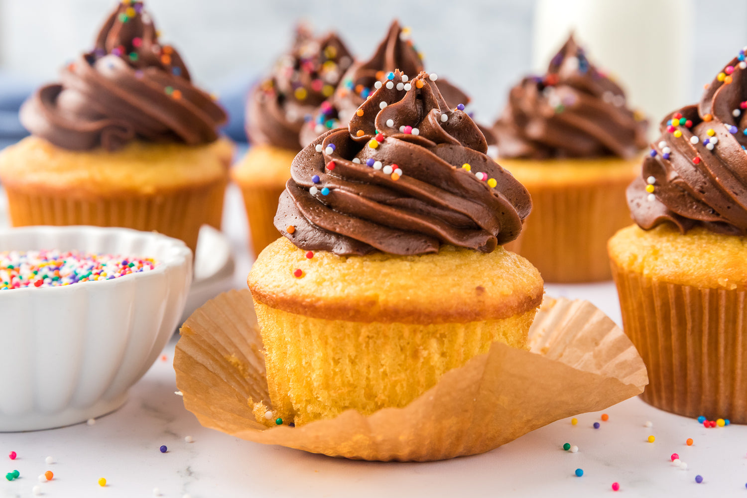 Yellow cupcakes with chocolate frosting